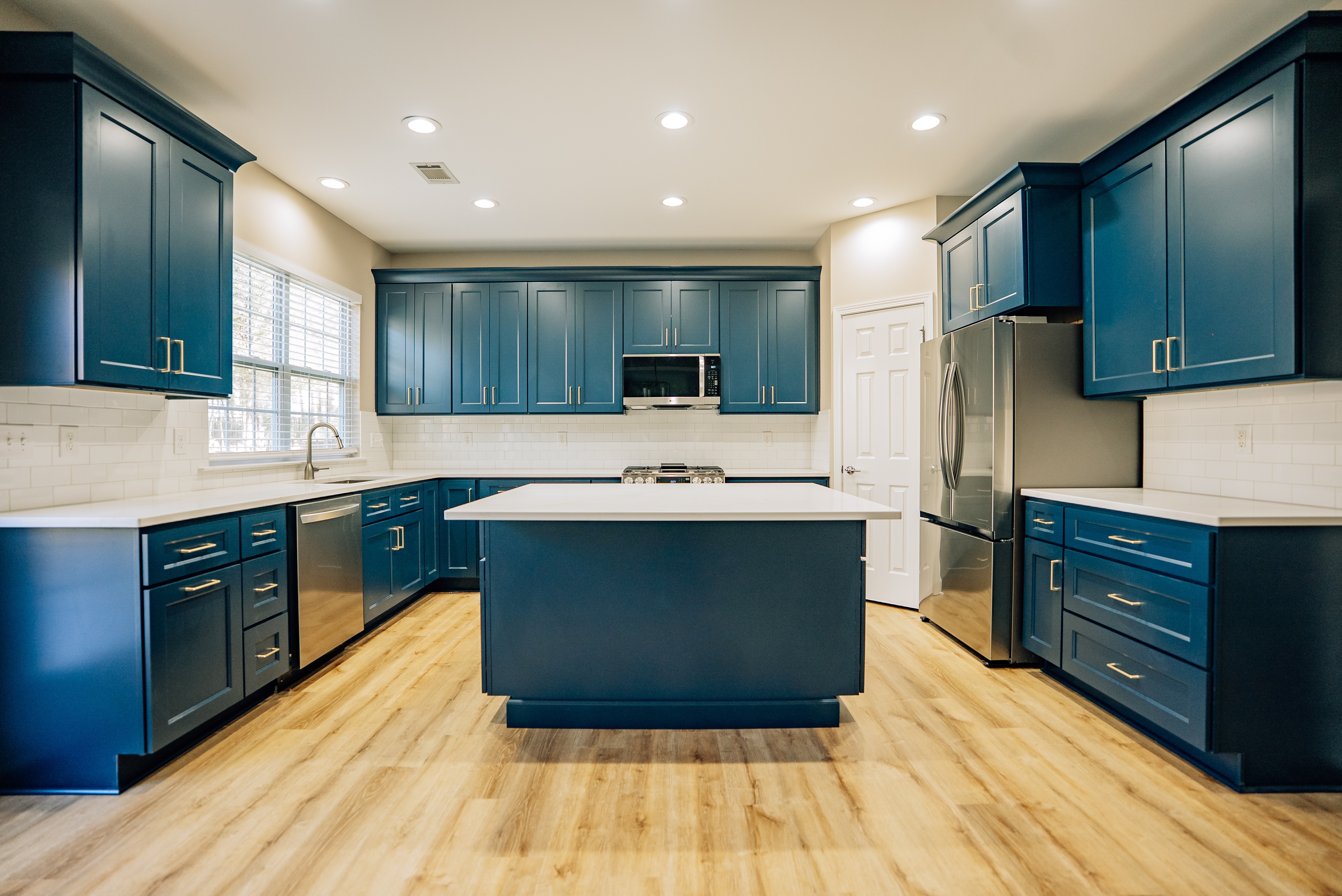 Modern Kitchen with Teal Cabinetry